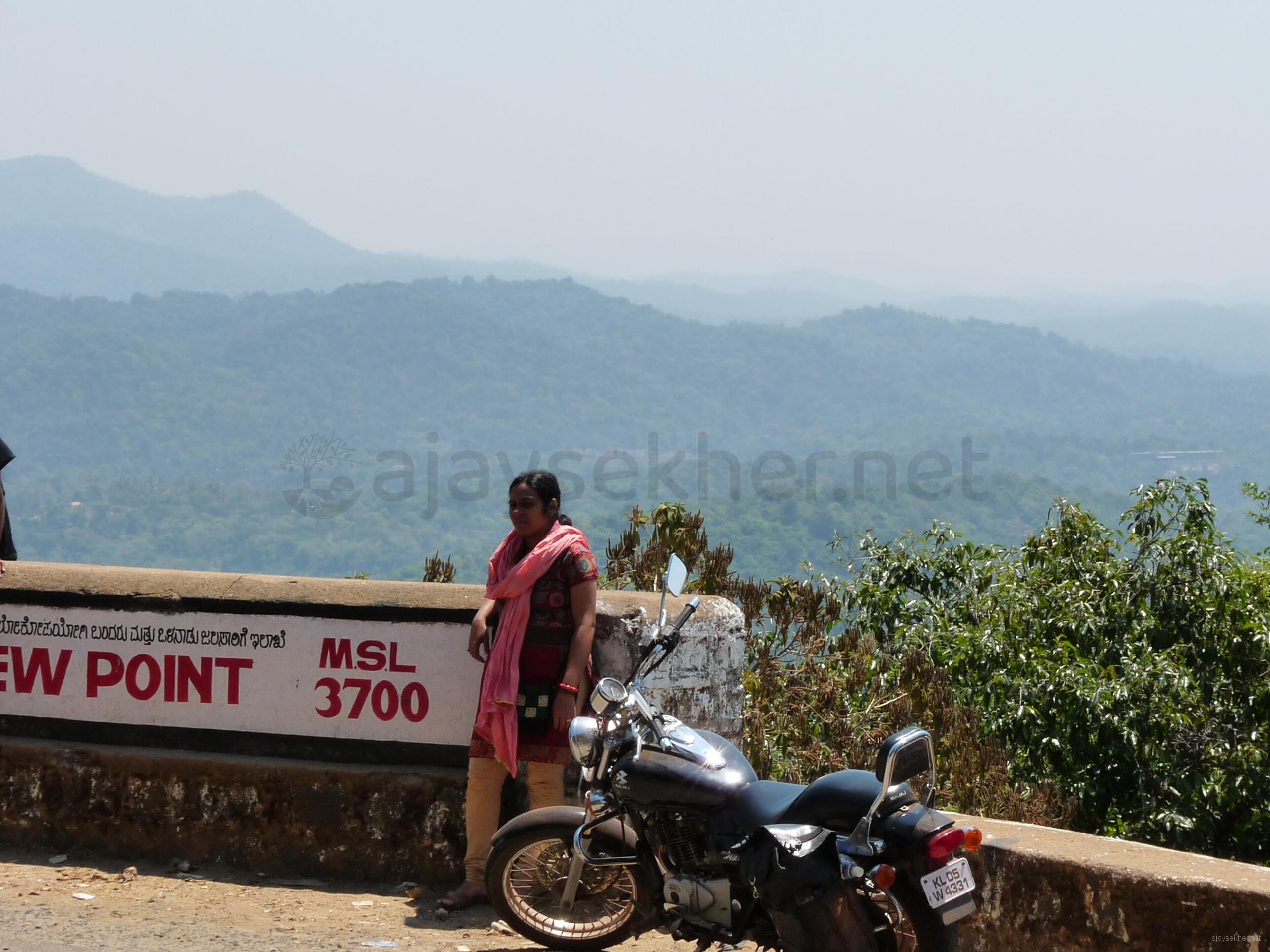 On the way to Talakavery: Jaime at 3700 MSL in Coorg.  Bhagamandala and Madikeri in backdrop