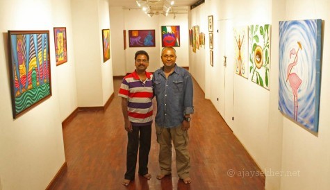 N P Jayan of Indian Express captured us together with elan at Calicut Lalitkala Akademi gallery. 23 Oct 2013.