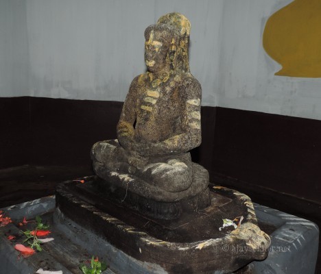 Ancient granite idol of the Buddha recovered in 1964 at Topil in Onampally.  See the Ushnisham or crown of hair, Utariyam or robe on left shoulder and Jwala or flame of enlightenment atop the hair that are the key markers of a Buddha idol.  Could be dated to 7th and 8th century AD and in early Teravada Anuradhapuram style.