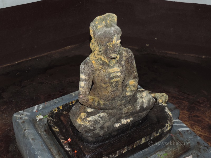 Black granite Buddha in deep meditating Padmasana at Topil, Onampally.  Exactly like the other Teravada Buddha idols so far recovered from Kerala in Anuradhapura style.  Identification and photo by Ajay Sekher 16.8.2014