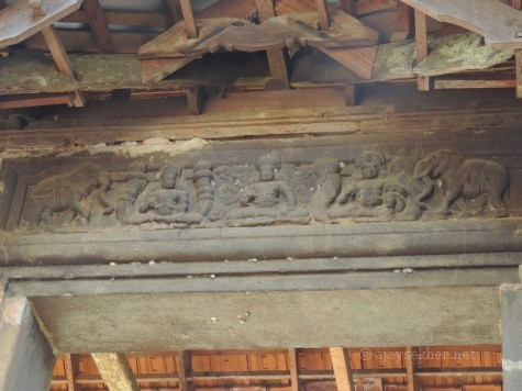 Top panel of the Anavatil or Elephant Gateway at Uliyanur Tevar temple. The relief shows figures in Padmasana and elephant motifs; two key Buddhist icons.