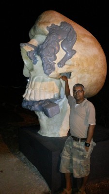 A Scull from Dalava Kulam that eats up the gate keeper: A sculpture installed at Vaikam by Sujit S N. Author of the essay Ajay Sekher before the work
